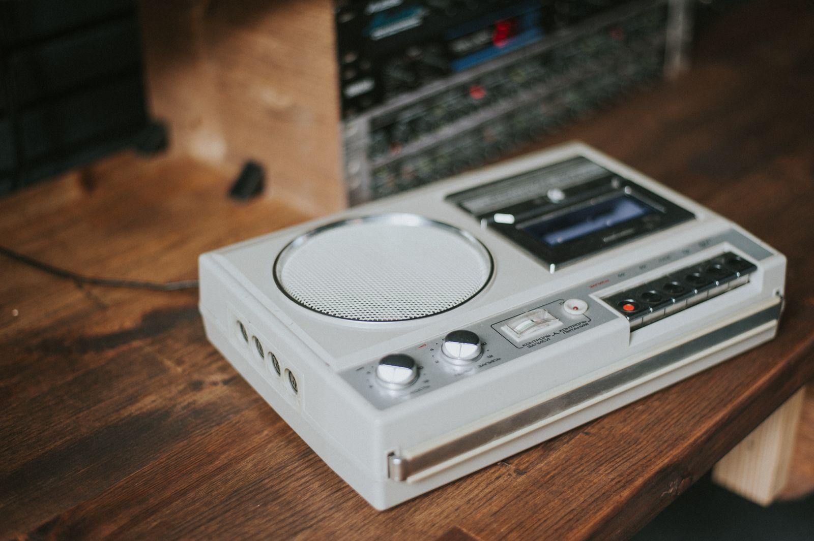 Grey cassette recorder on a wooden table