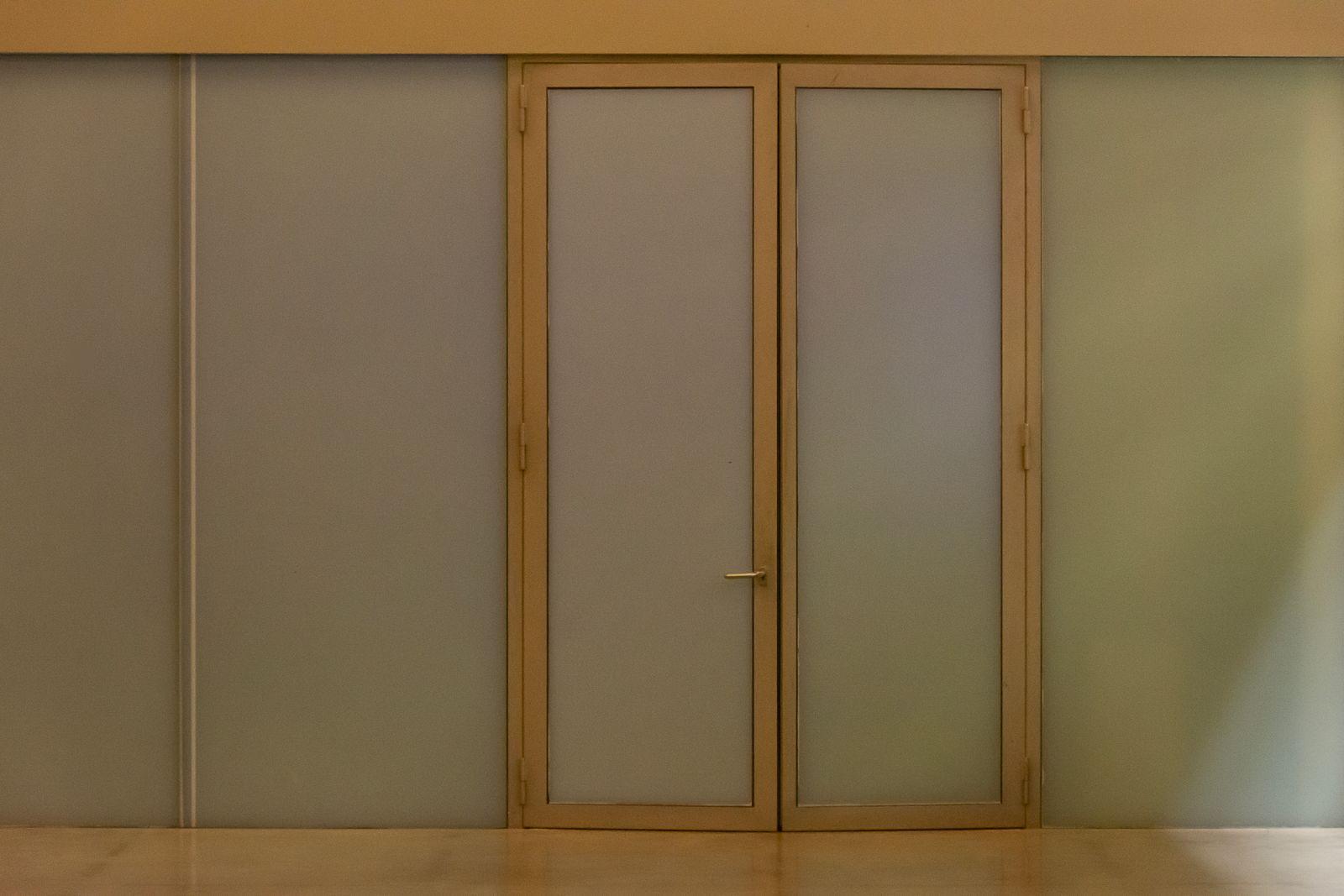 Closed wooden double doors in an office