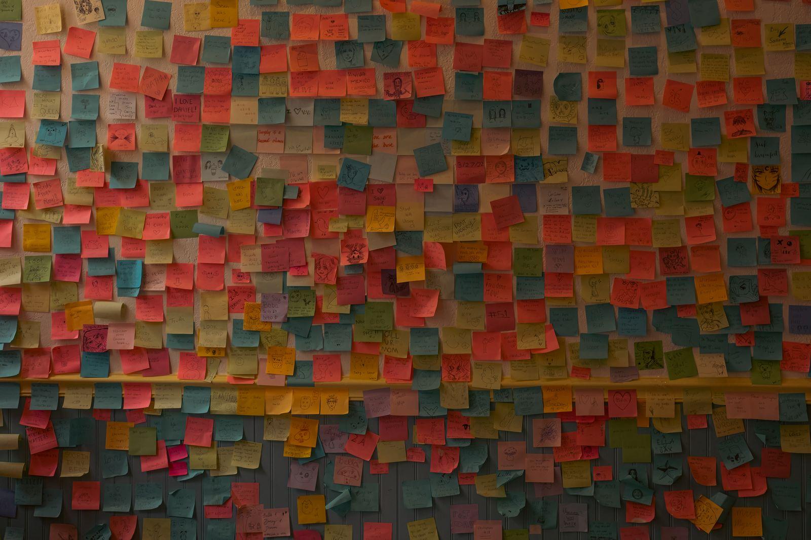 Wall covered in colorful sticky notes